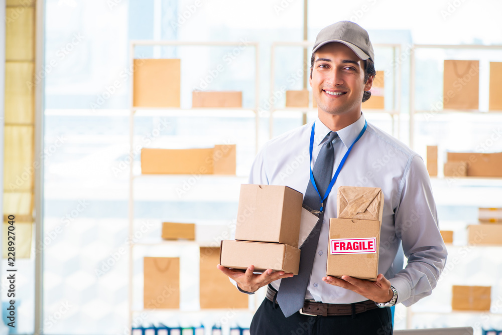 Male employee working in box delivery relocation service Male employee working in box delivery relocation service