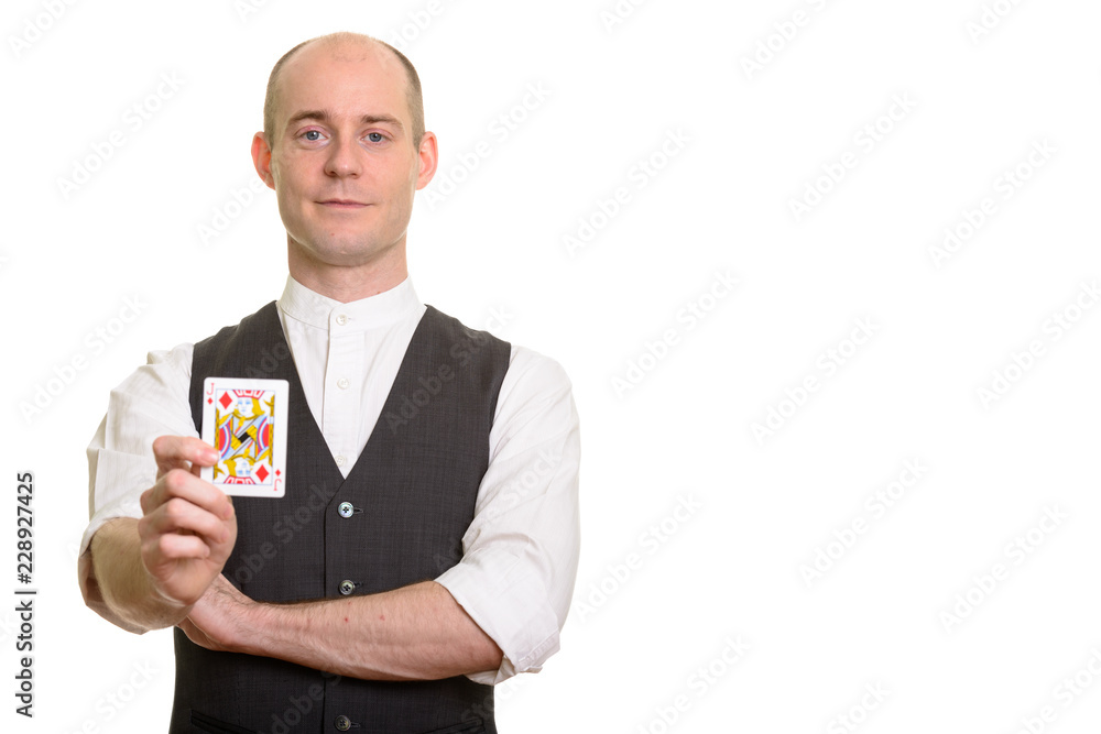 Bald Caucasian magician man holding Jack of Diamonds card Bald Caucasian magician man holding Jack of Diamonds card