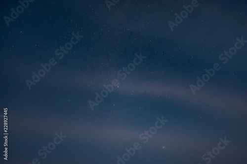 Starry sky through the clouds