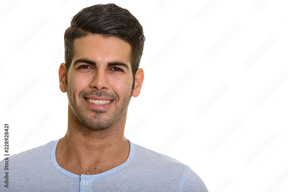 Studio portrait of young handsome Persian man smiling Studio portrait of young handsome Persian man smiling