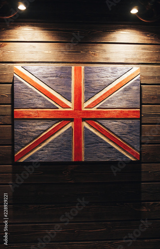 United Kingdom flag on wood background. Grunge United Kingdom flag. Wooden flag United Kingdom on a wooden wall
