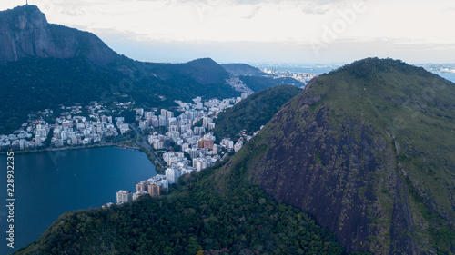 aerial view of the drone of the lagoon in rio de janeiro and copacabana  at dusk