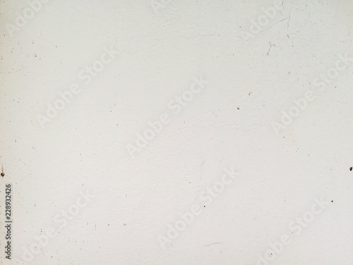 Old white cement wall with crack