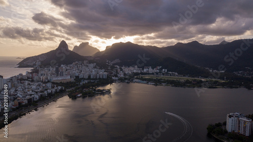 aerial view of the drone of the lagoon in rio de janeiro and copacabana, at dusk
