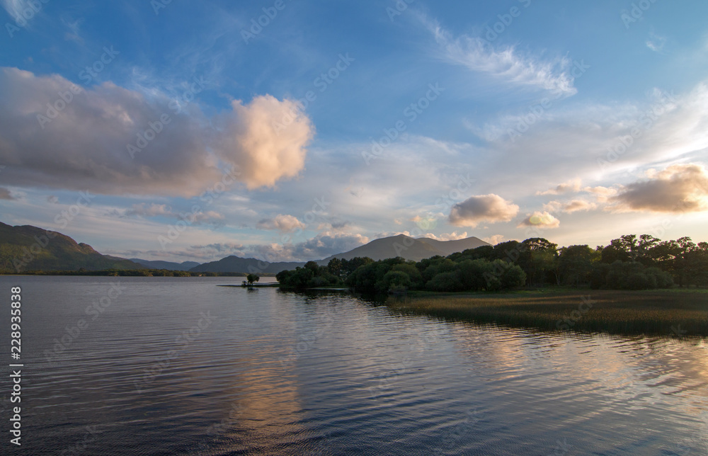 Sunset cumulus clouds over Lough Leane (Lake Leane) on the Ring of Kerry in Killarney Ireland