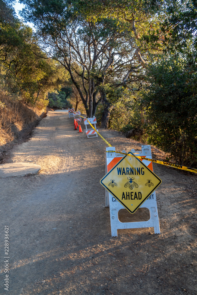 Bee hive warning along Water Dog Lake Trail, Belmont, California Stock