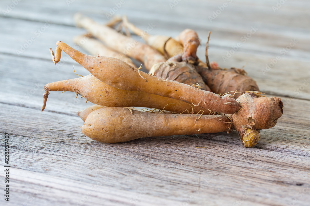 finger root Ingredients for Thai Cuisine on wooden table finger root Ingredients for Thai Cuisine on wooden table