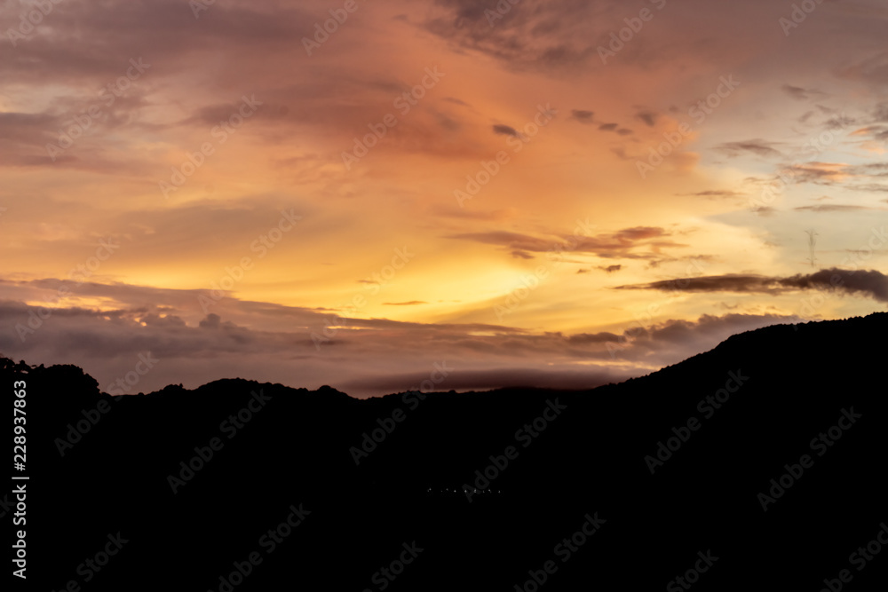 A dramatic sunrise over the city of Patong from the southern hillside.