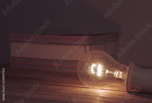 light bulb on books background © Weerameth