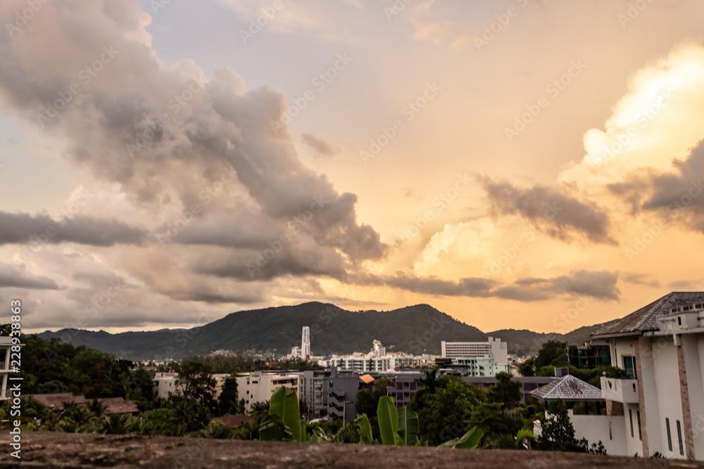 A dramatic sunrise over the city of Patong from the southern hillside.