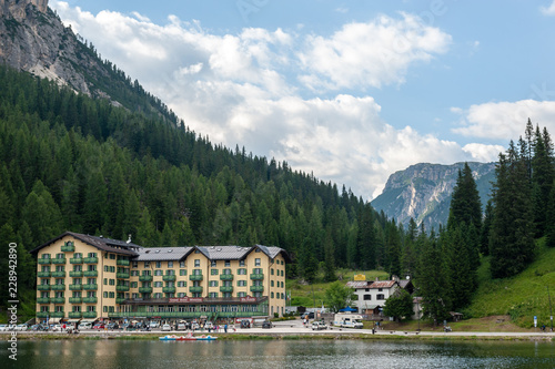 Imression of the buildings along the shoreline of Lake Misurina, in the Italian Dolomites, on a Summer's Afternoon. photo