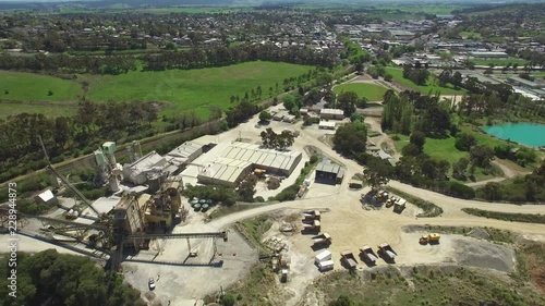 Flying over decommissioned limestone mine factory and quarry pit photo