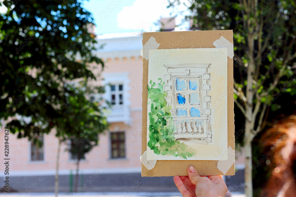 Fototapeta premium Watercolor drawing of the old city against the background of the city. City sketching, street sketches.