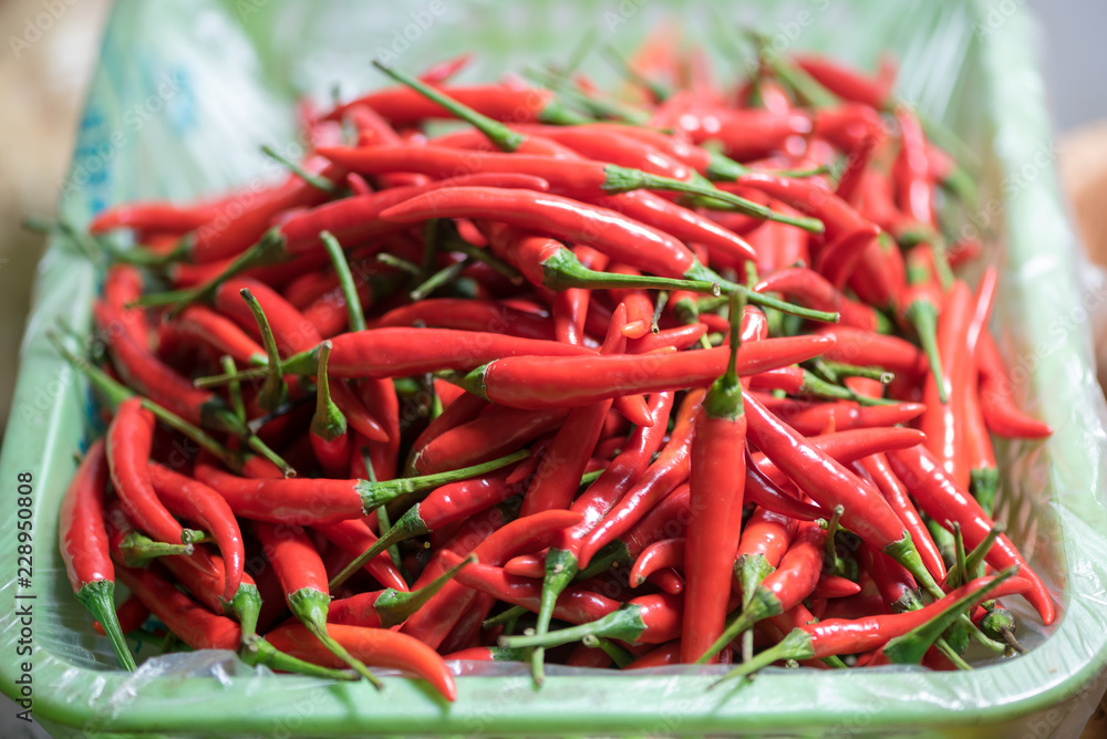 red chili pepper in a basket in a market red chili pepper in a basket in a market