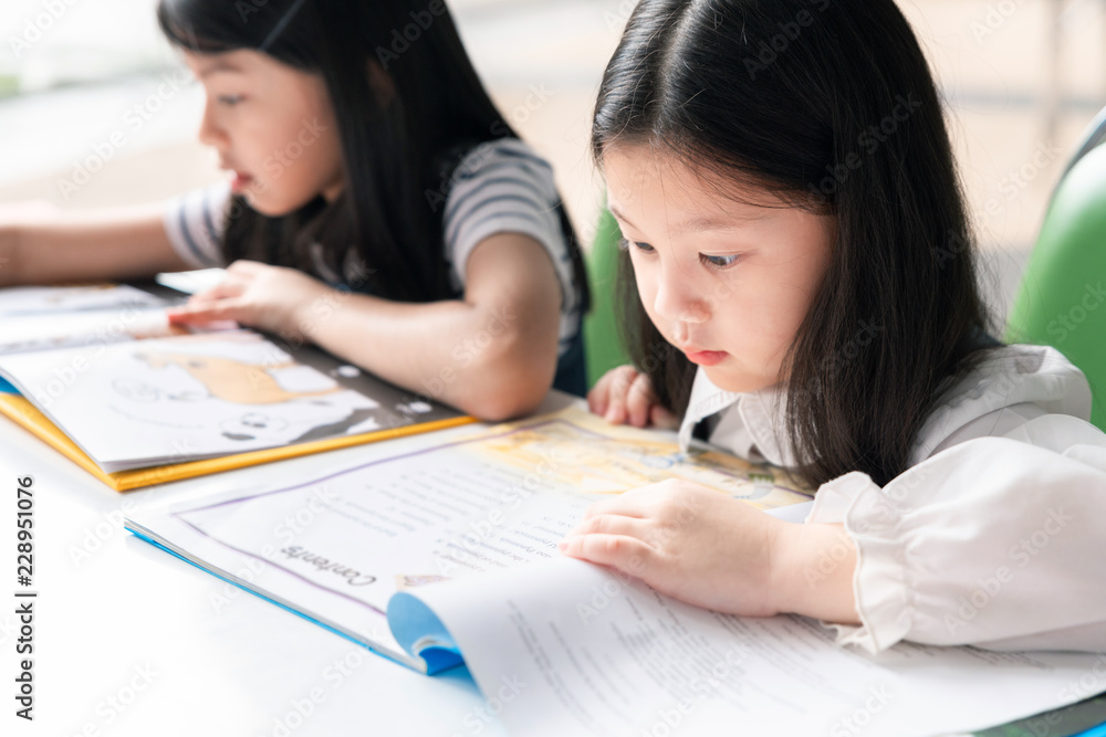 Asian Little Children Reading Book Cheerful Asian Little Children Reading Book Cheerful