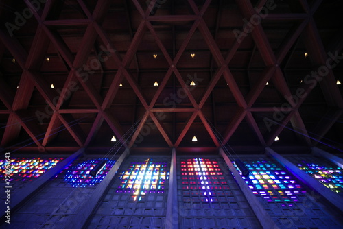 Baccarat,France-October 11, 2018: The interior of Saint Remy church in Baccarat illuminated by colorful crystals on the wall.  photo