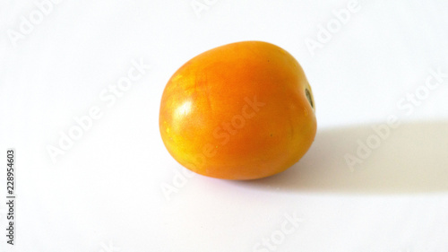 Yellow tomatoes On a white background