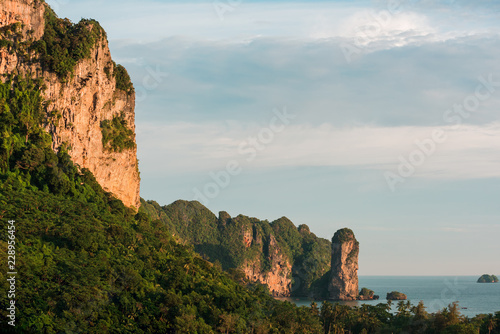 The scenic view on a sea with islands and the cliffs at sunset photo