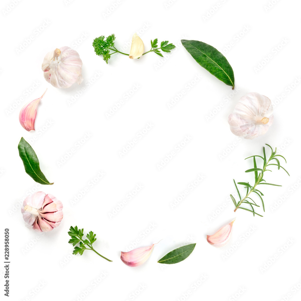 An overhead photo of a frame with garlic and herbs with a place for text. A cooking background with spices and copy space, shot from above on white An overhead photo of a frame with garlic and herbs with a place for text. A cooking background with spices and copy space, shot from above on white