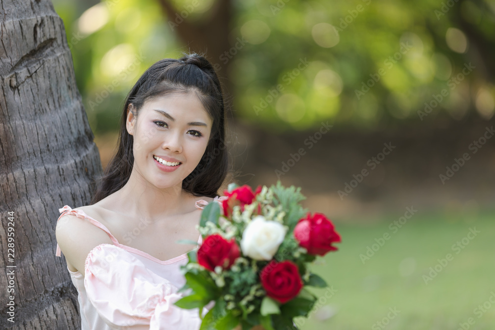 young woman asian girl with roses red smiling hoppy in valentines day young woman asian girl with roses red smiling hoppy in valentines day