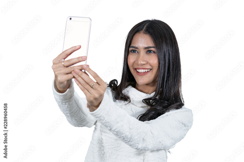 Portrait Asian woman taking selfie via technology smart mobile phone on white background, isolate include clipping path, fashion and lifestyle concept Portrait Asian woman taking selfie via technology smart mobile phone on white background, isolate include clipping path, fashion and lifestyle concept