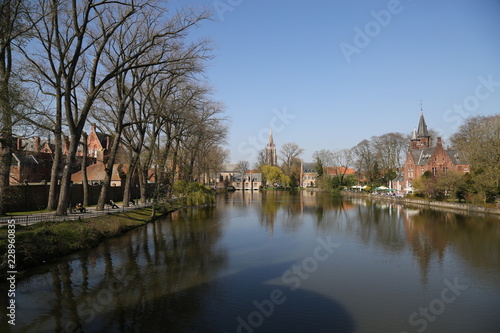 Canal of Bruges with old traditional houses.