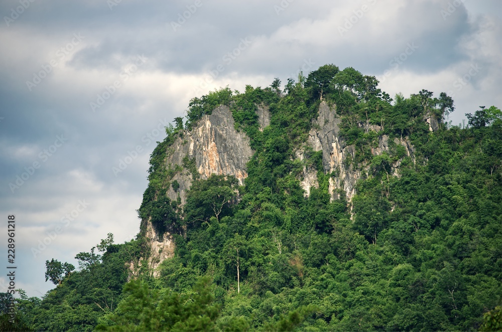 Cliff mountain stone with cloud sky background : Thailand