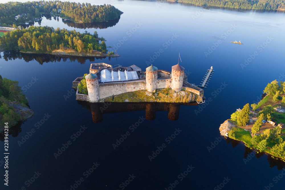A view from the height of the Olavinlinna fortress on an early July morning (shooting from a quadrocopter). Savonlinna, Finland