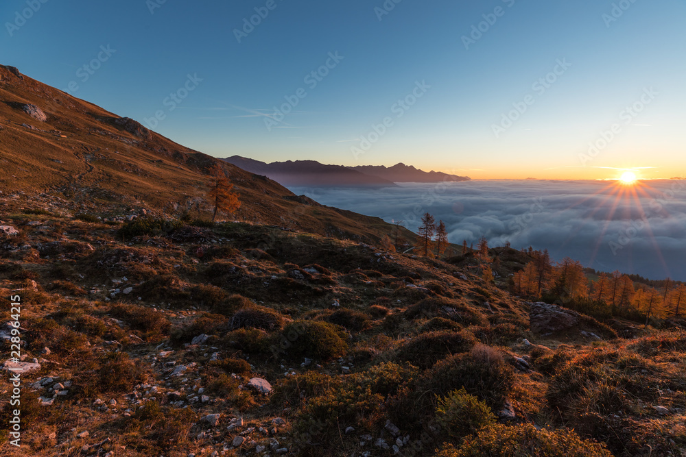 Colorful Autumn Sunrise Above The Clouds In The Lienz Dolomites Above Hochstadelhaus