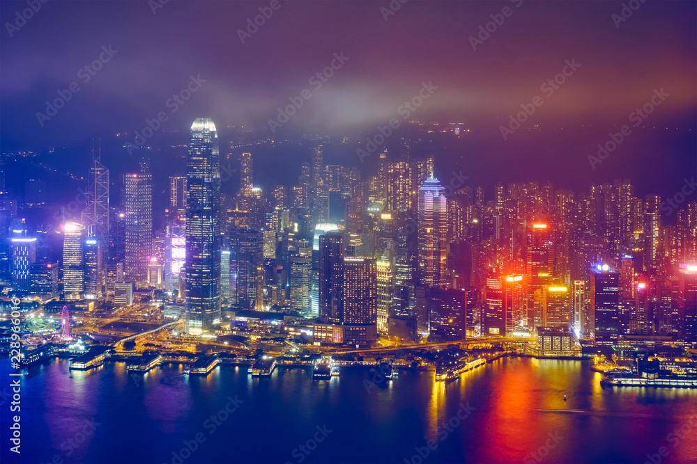 Aerial view of illuminated Hong Kong skyline. Hong Kong, China