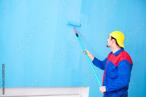 Young painter doing renovation at home 