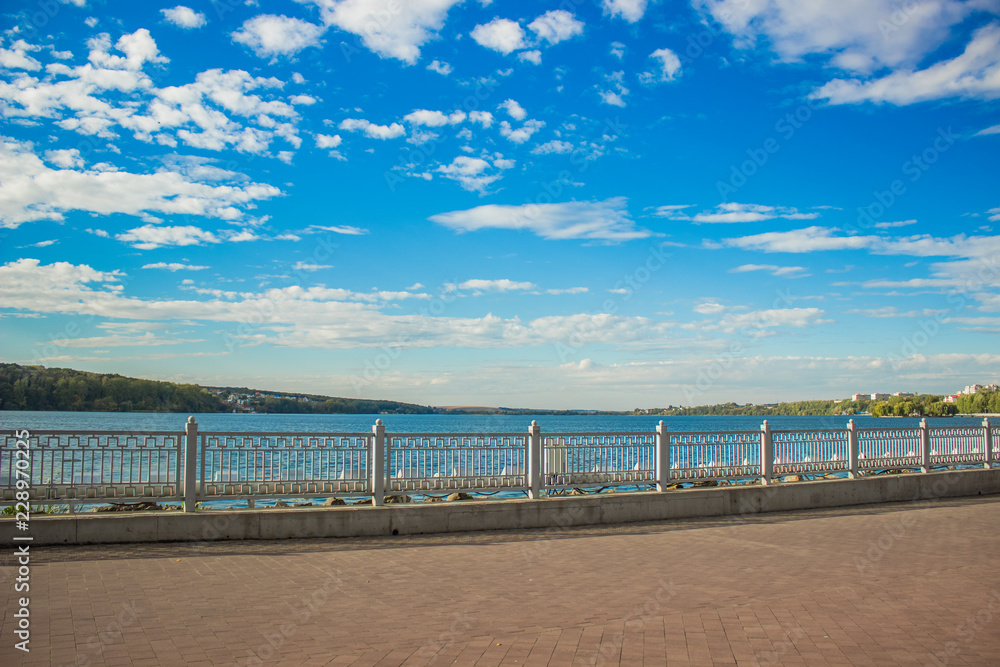 city waterfront lake walking space in park outdoor district without people in summer bright colorful day time  