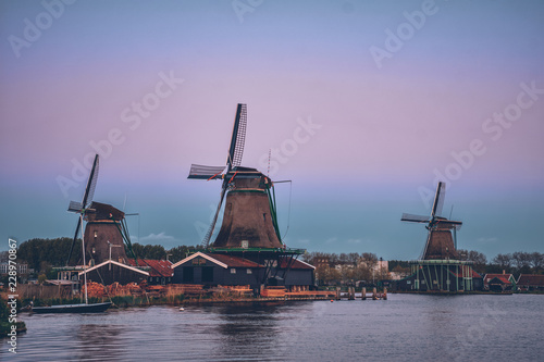 Windmills at Zaanse Schans in Holland in twilight after sunset.