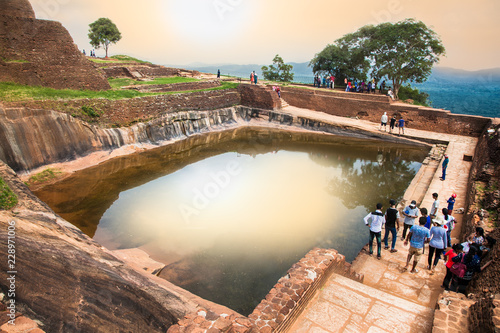 Vászonkép Tourists are waiting to climb on Sigiriya rock fortress in Sigiriya , Sri Lanka