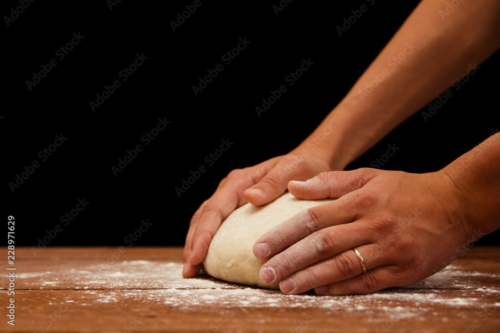 photo of women's hands that knead the dough
