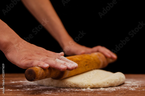 photo of women's hands that knead the dough