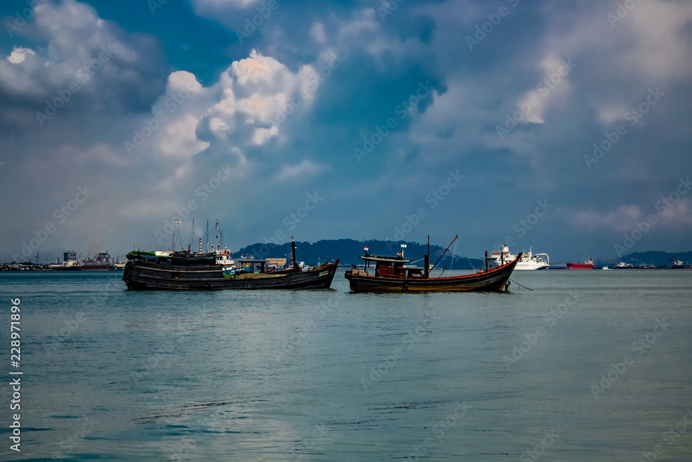 Looking out into the main shipping lane and harbour of Georgetown, Penang Malaysia on a sunny warm day
