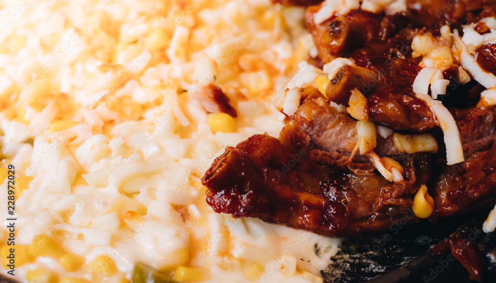 Korean pork ribs wrapped in gooey, stretchy mozzarella cheese studded