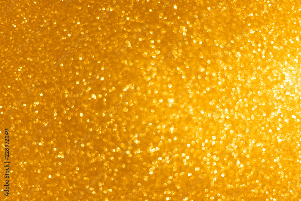 Luxury dark gold christmas asymmetric bokeh background. Abstract texture with defocused golden lights Luxury dark gold christmas asymmetric bokeh background. Abstract texture with defocused golden lights
