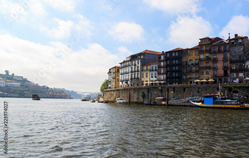 View of the Ribera from the water  Porto  Portugal. Colorful houses on the embankment of the river Douro.