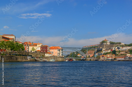 City view from the river Douro. Porto, Portugal. Dom Luís I Bridge.