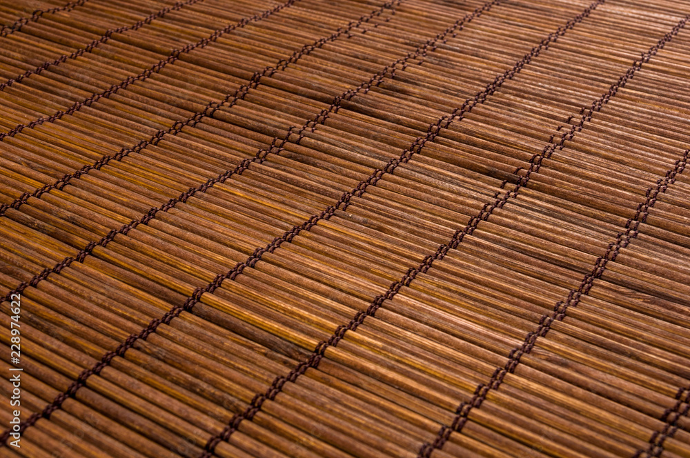 bamboo Mat - stand food, close-up, wooden background bamboo Mat - stand food, close-up, wooden background