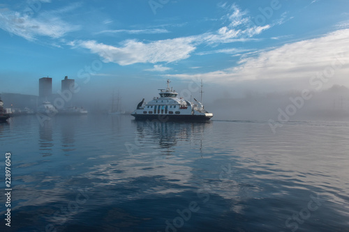 Boat on the sea at morning fog. Oslo, Norway