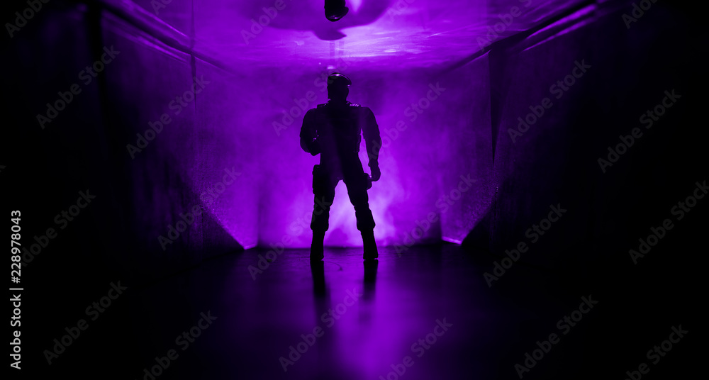 Creepy silhouette in the dark abandoned building. Horror about maniac concept or Dark corridor with cabinet doors and lights with silhouette of spooky horror person Creepy silhouette in the dark abandoned building. Horror about maniac concept or Dark corridor with cabinet doors and lights with silhouette of spooky horror person