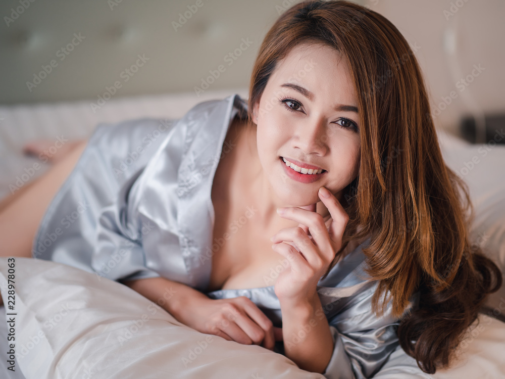 Beautiful asian woman sexy model in sleepwear on bed at home in the morning bedroom. Beautiful asian woman sexy model in sleepwear on bed at home in the morning bedroom.