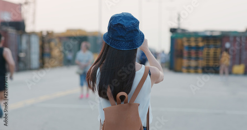 Photography Tourist woman take photo on mobile phone in Hong Kong landmark