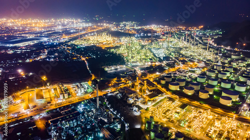 Oil storage tank with oil refinery background, Oil refinery plant at night.Aerial view from drone top view © jamesboy