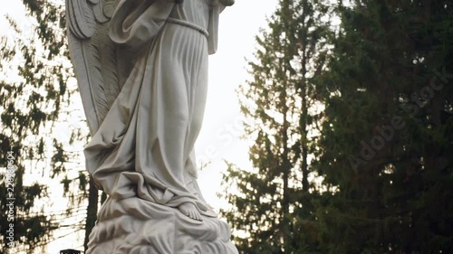 Monument to the angel and trees in the background