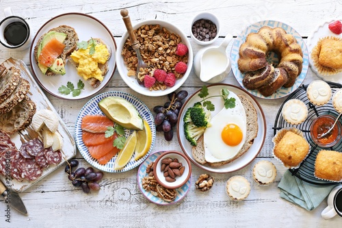 Brunch. Family breakfast or brunch set served on rustic wooden table. Overhead view, copy space