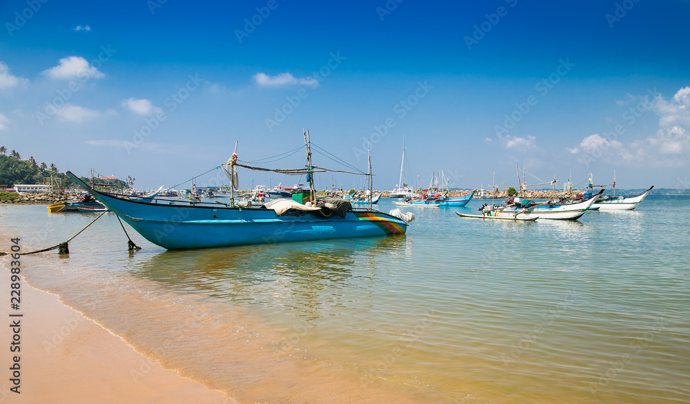Colorful boats in fisheries harbor of Weligama, Sri Lanka.